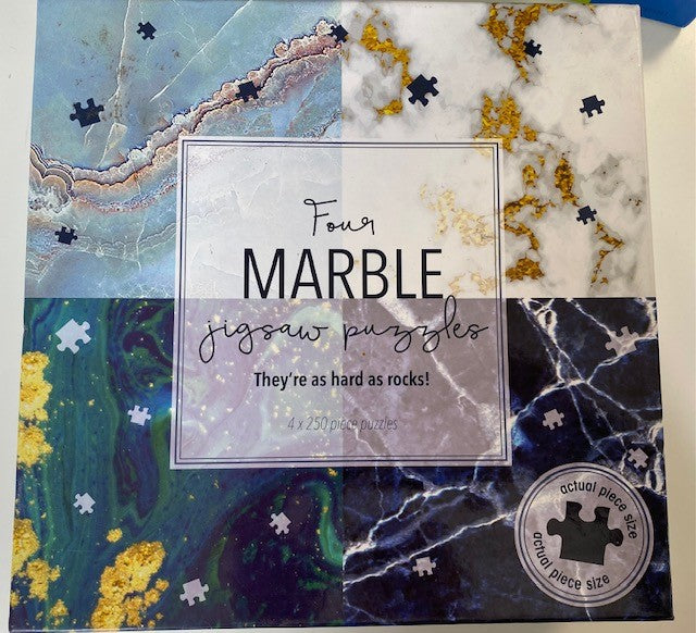 Used- Four Mable Puzzles 250 Pieces each
